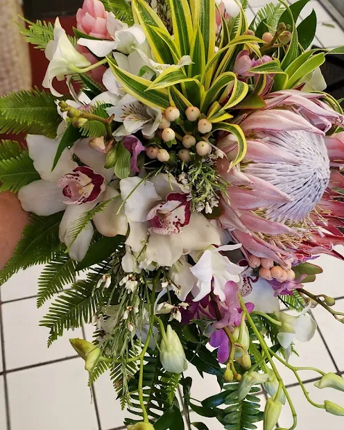 A tall lily and rose arrangement